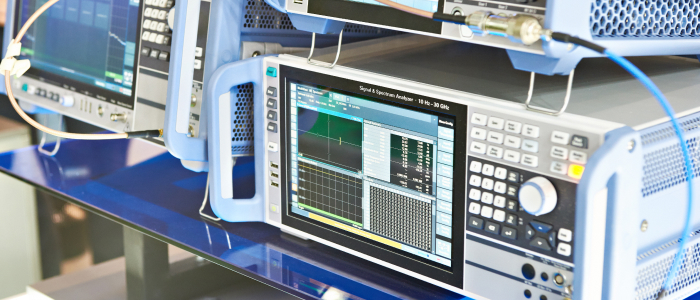 "Signal and spectrum analyzers used for conducting EMI and EMC testing in electronics manufacturing, highlighting the importance of electromagnetic interference and compatibility assessments for high-quality production.